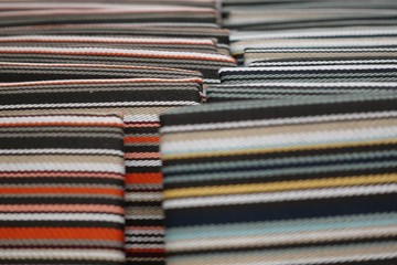 Pile of colorful cotton and wool textile on store