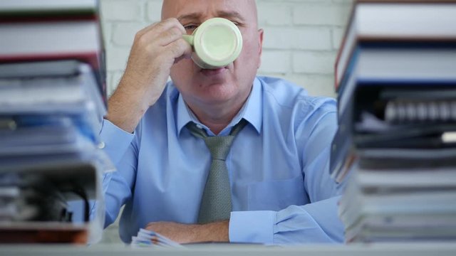 Businessperson in Accounting Office Take a Pause Drinking Coffee