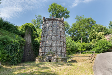 Tourist itinerary on Lake Maggiore, Italy. One of the old lime kilns, an example of industrial archeology, near the town of Ispra along the circular route of the kilns of about 5 - 6 km