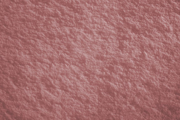 Abstract red-brown textured snow surface background. Tinted texture
