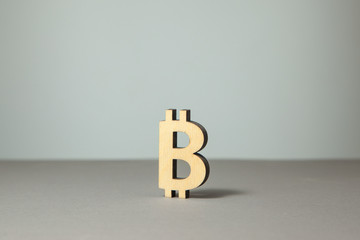 Symbols of bitcoin crypto-currency on a gray