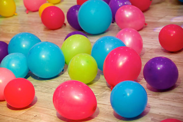 Balloons of different colors lie on the floor