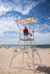 Rescue tower with savior near the sea