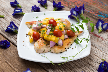 Clean food, Grilled chicken breasts , mango , tomato and vegetables.