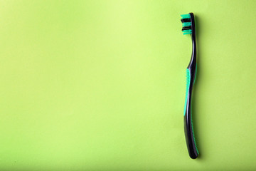 Manual toothbrush on color background. Dental care