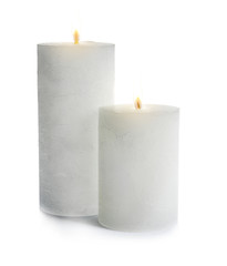 Two decorative wax candles on white background