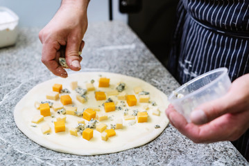 chef making pizza