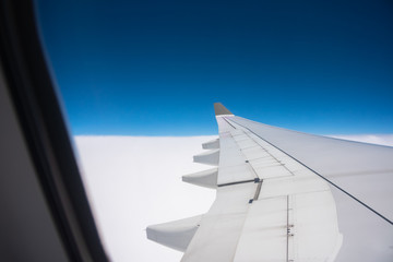 aircraft window with blue sky.