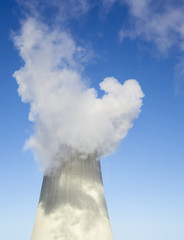 Cooling tower with water vapor over it