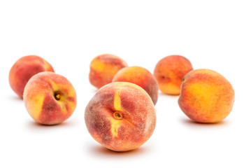 Ripe peaches on white.