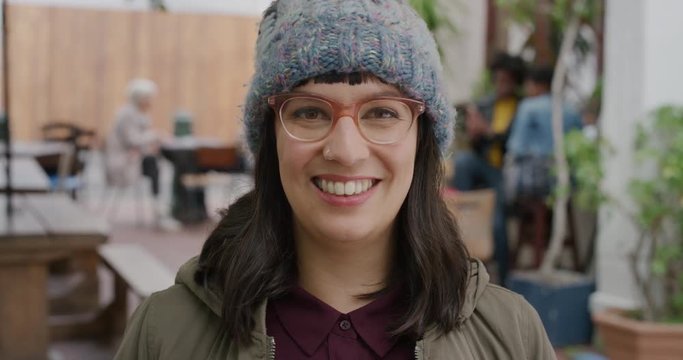 portrait of happy hipster woman wearing funky glasses smiling cheerful looking at camera