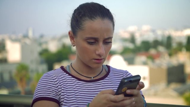 Free Spirited Teenage Girl Texting Surprised Reaction. 4K