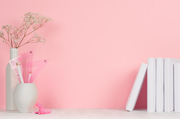Back to school backgrounds for girl - white and pink stationery, books on white wood table and pink wall.