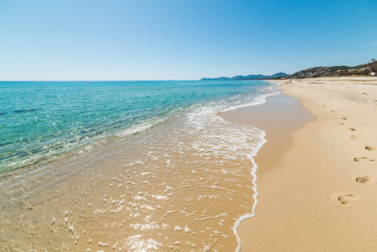 Fototapeta Złoty piasek i turkusowa woda na plaży Piscina Rei