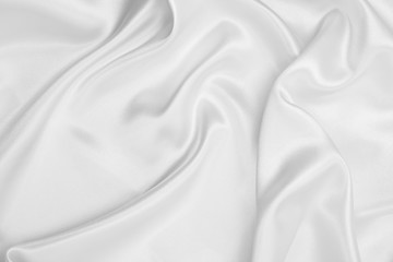 Smooth elegant white silk or satin luxury cloth texture as wedding background. Luxurious background design