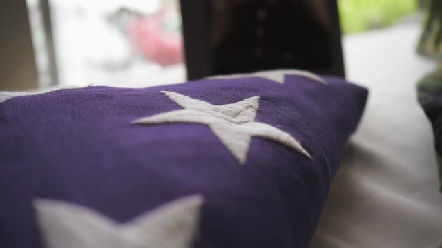 Folded American Flag On Table Close Up.