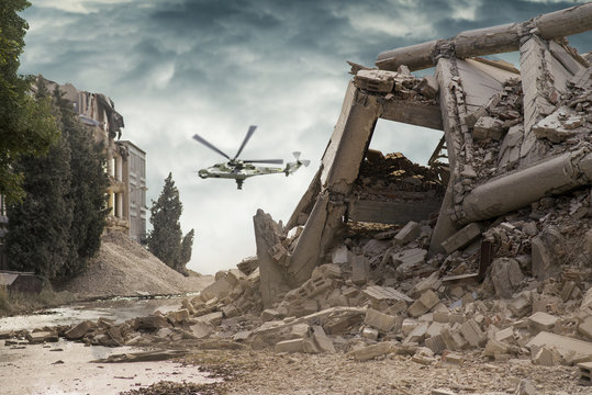 View on a collapsed concrete industrial building with an attack helicopter Mi24 in dark dramatic sky above