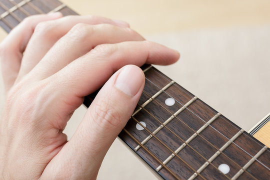 Close Up of Hand on a Guitar Fingerboard
