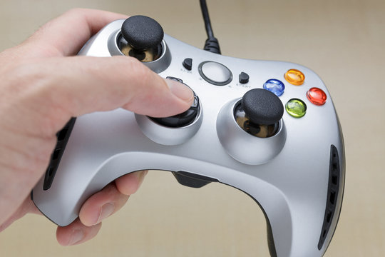 Hand with a Video Game Controller or Gamepad