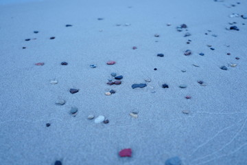 Small pebbles on a sandy beach. Beach Amber. Kaliningrad region. Russia.