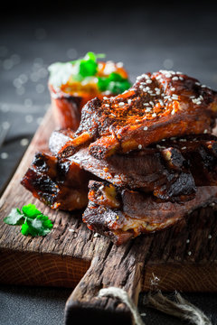 Spicy and tasty roasted ribs with potato and sesame