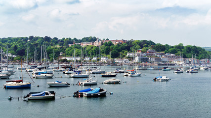 Fototapeta na wymiar Dartmouth, Devon, United kingdom 25 may, 2018. boats and yachts, colorful houses, hotel on Dart river on summer day