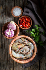 Preparation for fresh and tasty shrimp on wooden bowl