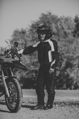 Fototapeta na wymiar Man riding a touring motorbike during a trip across the mountains.
