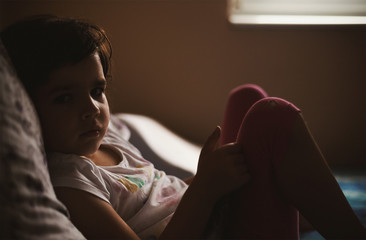 Portrait of a Small Girl on Bed