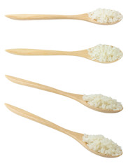 Spoons of Raw Japanese Rice on White