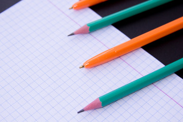 school supplies on chalkboard background