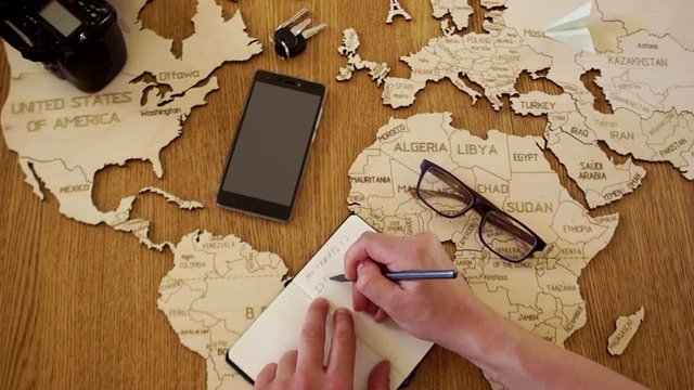 Dreams of traveling to Paris, France, the Eiffel Tower. Wooden model of the Eiffel Tower. Notepad, travel plan