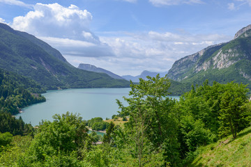 Fototapeta premium Village and lake Molveno in western Trentino Alto Adige, Italy