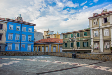 beautiful cozy and calm Italian yard building apartment facade in old city backstreet district in colorful bright summer day time with blue sky cloud background