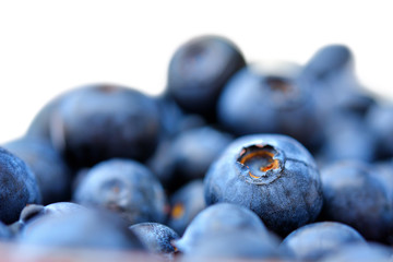 Stack of sweet fresh colorful blueberries  isolated on white background. Selective focus