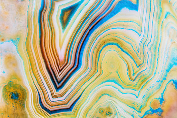 Amazing detailed and colorful cross section structure of banded yellow agate. Seamless crystal agate surface macro closeup. Marbled pattern mineral texture abstract background - obrazy, fototapety, plakaty