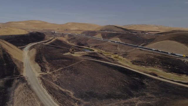 Aerial footage of a 650 acre fire started in the Altamont hills between Tracy and Livermore in California.