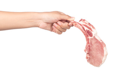 hand holding raw pork chops isolated on white background