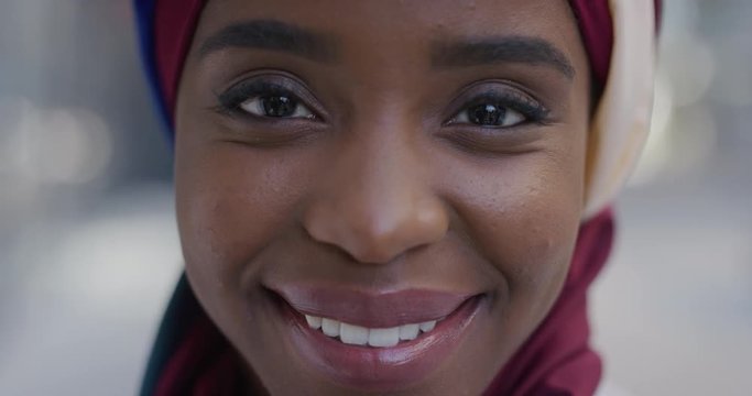 close up portrait young african american business woman laughing enjoying successful urban lifestyle beautiful black muslim female wearing traditional hijab headscarf in city