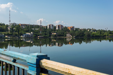 Obraz premium view of the city's waterfront on the river from the bridge.