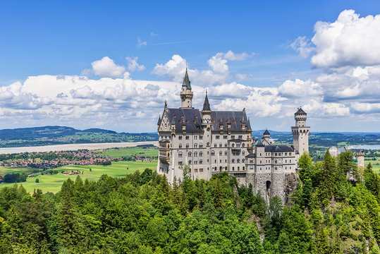Hohenschwangau, Germany - June 10, 2018: The idyllic Neuschwanstein Castle positioned high up on a mountain in the Bavarian Alps. Commissioned by King Ludwig II of Bavaria.