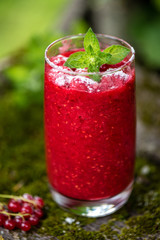 Raspberry smoothies with mint on rustic background