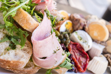 Healthy fresh dish with typical Maltese food with ham and raw spring or summer mediterranean vegetables