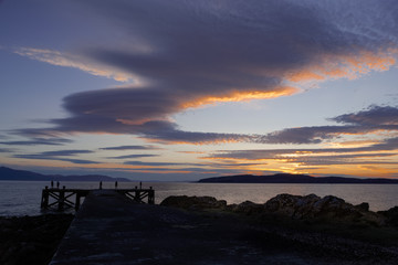 Fishing Off Jetty at Sunset in Scotland