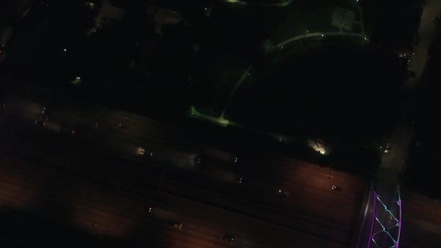 This video is about an aerial view of cars traveling on freeway in Houston at night. This video was filmed in 4k for best image quality.