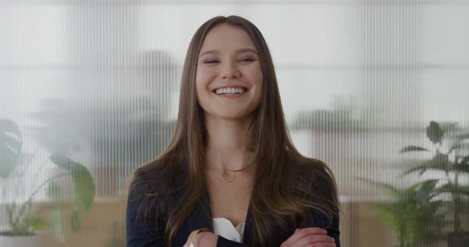 portrait young successful business woman executive smiling arms crossed enjoying professional career lifestyle cheerful female entrepreneur in office