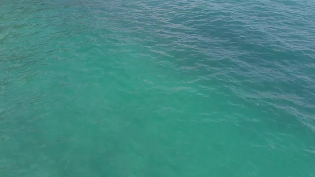 Footage of a clear blue ocean off the coast of Italy.