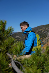 Naklejka premium Backpacker hiker tourist in Rocky Mountains