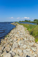 Fototapeta premium Small dike at the Schildmeer lake in Groningen, Netherlands