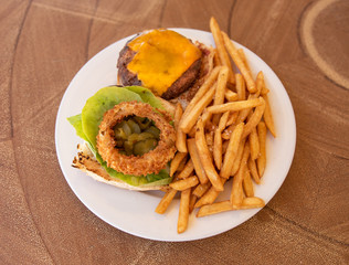 Cheeseburger Plate With French Fries And Onion Ring